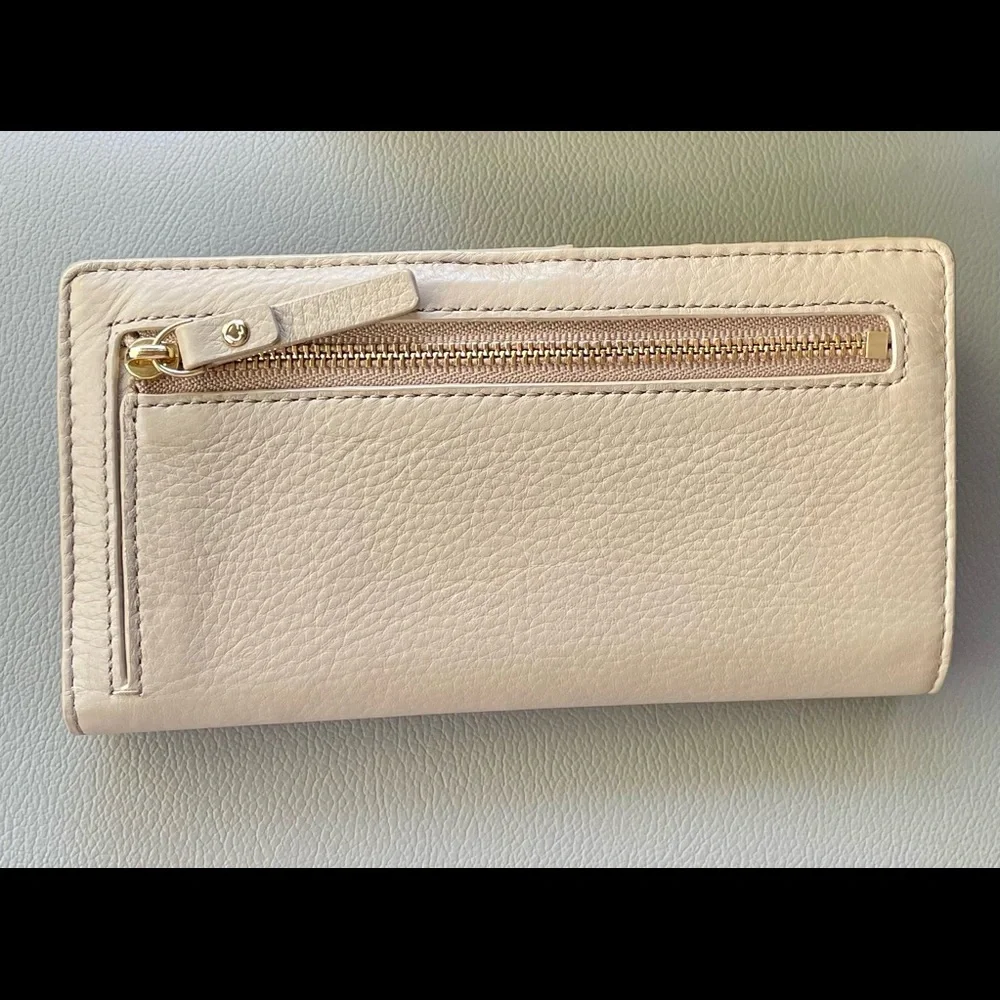kate spade pale pink bow zip-around wallet
